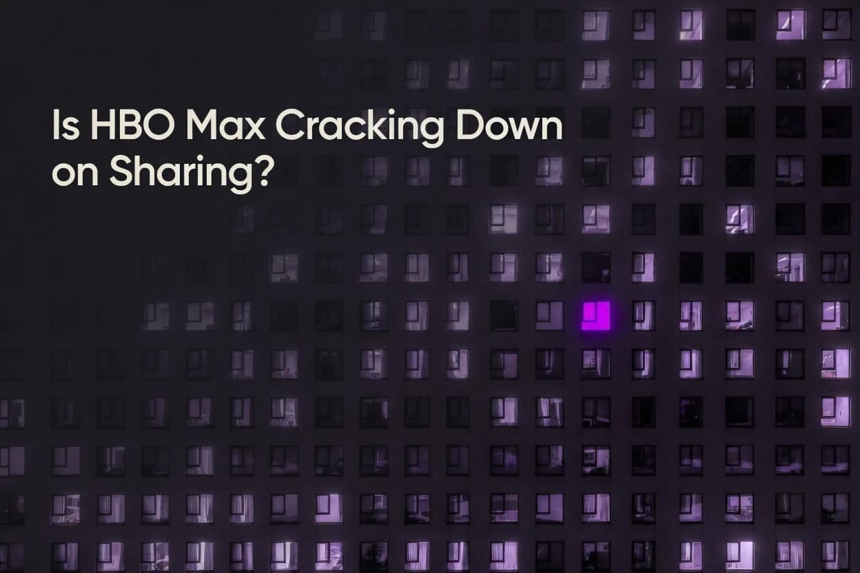 One apartment window glowing violet among dozens of identical windows, symbolising how HBO Max is cracking down on sharing by singling out individual households